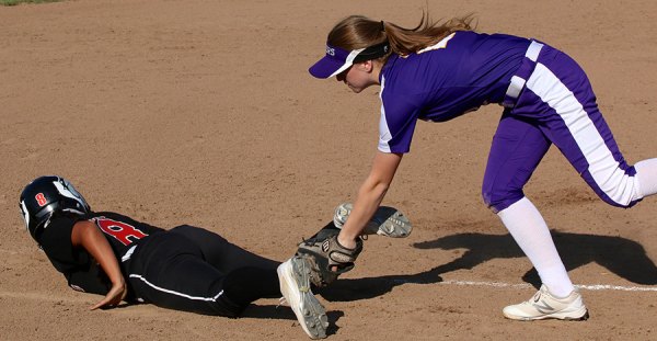 Megan Van Allen goes for the tag in a recent game against Hanford. The Tigers split their pair games this week with just two left in the season.